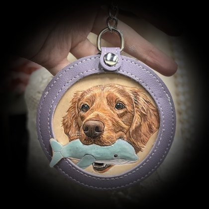 Golden retriever with a whale toy