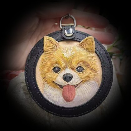 Pomeranian in a black frame