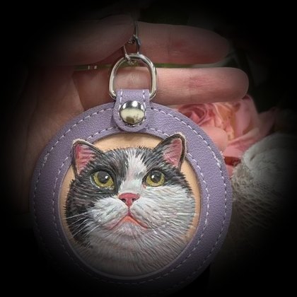Calico cat in a lavender frame